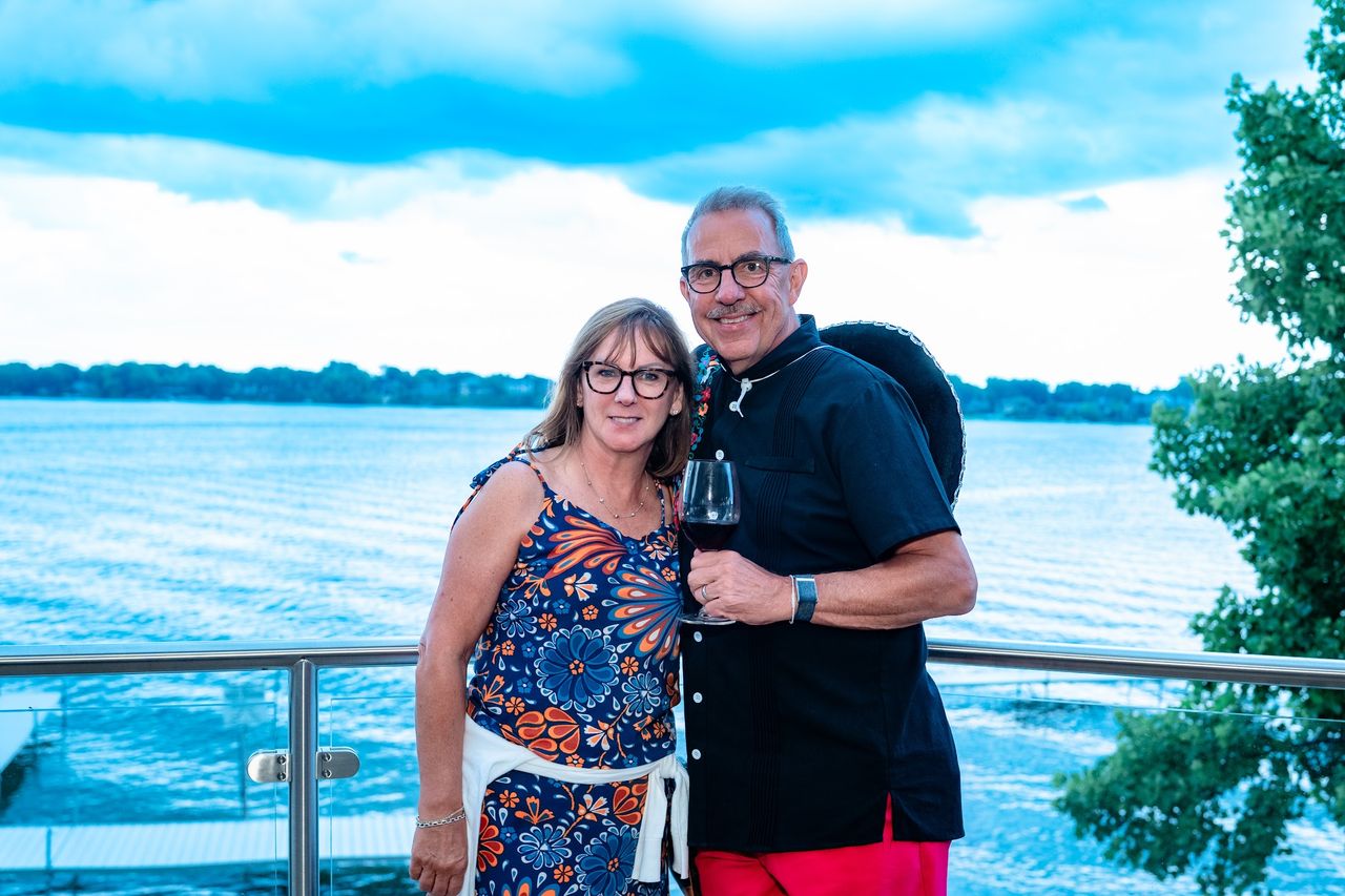 A couple on the lakeside deck