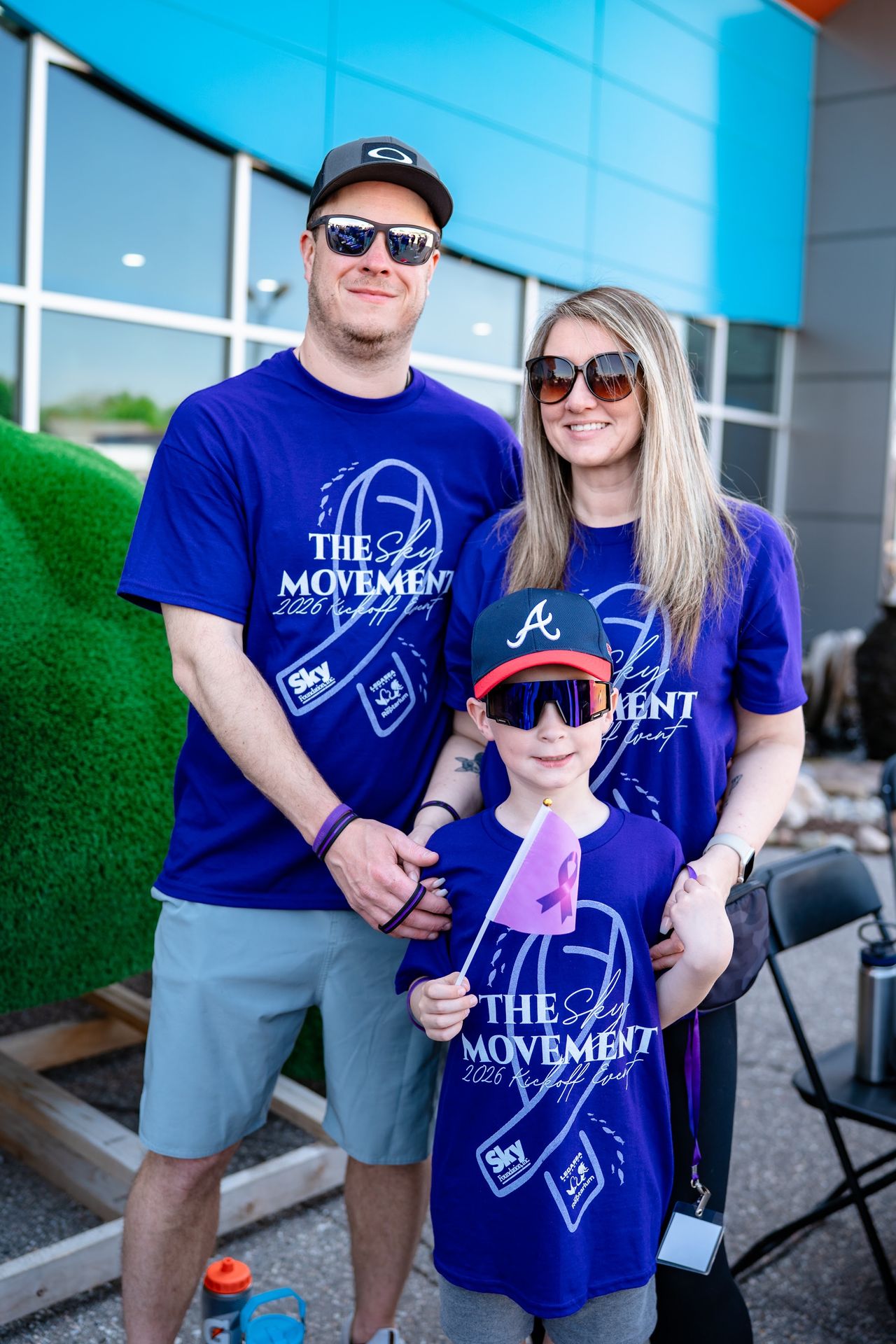 A dad and his son in Movement shirts