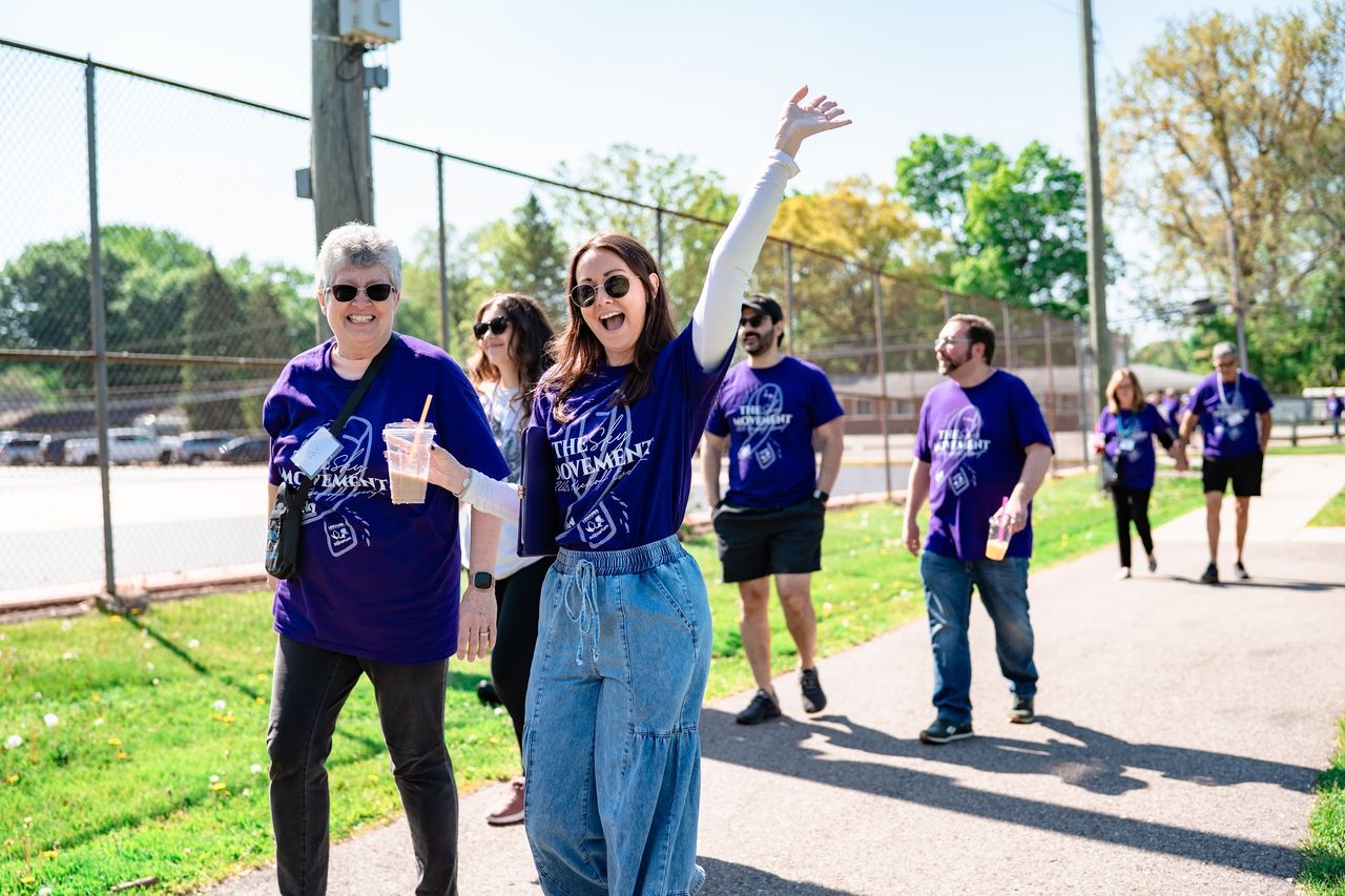A walker waving on the route